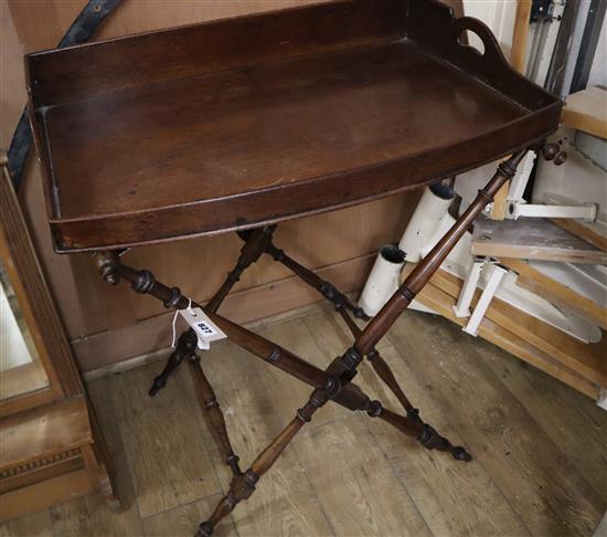 A Victorian mahogany bow fronted butlers tray on folding stand Tray W.74cm